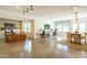 Spacious living space featuring multiple work areas, dining area, and plenty of natural light at 5265 Aleppo Ln, Raleigh, NC 27613