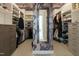 Spacious walk-in closet with custom shelving, drawers, and a decorative ceiling and mirror at 5265 Aleppo Ln, Raleigh, NC 27613