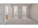 Bright bedroom with vaulted ceilings, carpet flooring, and arched windows at 5504 Spring Bluffs Ln, Raleigh, NC 27606