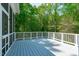 Spacious deck with white railings and wooded backyard views at 5504 Spring Bluffs Ln, Raleigh, NC 27606
