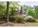 Charming brick home with a chimney, a large yard and a wooden deck at 5504 Spring Bluffs Ln, Raleigh, NC 27606