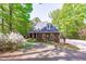 Charming brick home with a beautiful paved driveway and well-maintained landscaping at 5504 Spring Bluffs Ln, Raleigh, NC 27606
