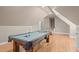 Spacious game room with hardwood floors, a pool table, and overhead lighting at 5504 Spring Bluffs Ln, Raleigh, NC 27606