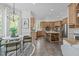 Eat-in kitchen with stainless steel appliances, a wine rack, tile floors, and a breakfast nook at 5504 Spring Bluffs Ln, Raleigh, NC 27606