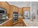 Kitchen with granite countertops, stainless appliances, and a tile backsplash at 5504 Spring Bluffs Ln, Raleigh, NC 27606