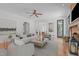 Bright living room with a stone fireplace, modern furniture, and plenty of space at 5504 Spring Bluffs Ln, Raleigh, NC 27606