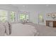 Spacious main bedroom with a seating area and ensuite bathroom at 5504 Spring Bluffs Ln, Raleigh, NC 27606
