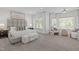 Main bedroom with carpet, neutral colors, and sitting area at 5504 Spring Bluffs Ln, Raleigh, NC 27606