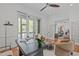 Bright home office with hardwood floors, natural light, and a walk-out to the outdoor balcony at 5504 Spring Bluffs Ln, Raleigh, NC 27606