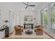 Bright home office with hardwood floors, natural light, and a walk-out to the outdoor balcony at 5504 Spring Bluffs Ln, Raleigh, NC 27606