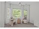 Cozy seating area with natural light streaming through large windows at 5504 Spring Bluffs Ln, Raleigh, NC 27606