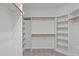 Spacious walk-in closet with built-in shelving and ample storage space at 5504 Spring Bluffs Ln, Raleigh, NC 27606
