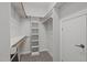 Bright walk-in closet offering ample storage with built-in shelving and hanging rods at 5504 Spring Bluffs Ln, Raleigh, NC 27606