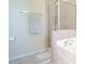 Bright bathroom featuring a shower with glass doors and a soaking tub at 5901 Chivalry Ct, Raleigh, NC 27612
