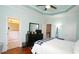 Well-lit bedroom with hardwood floors and a ceiling fan at 5901 Chivalry Ct, Raleigh, NC 27612
