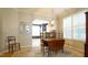 Open dining area featuring hardwood floors and lots of natural light at 5901 Chivalry Ct, Raleigh, NC 27612