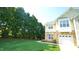 Charming two-story home featuring a stone facade and attached one car garage at 5901 Chivalry Ct, Raleigh, NC 27612