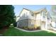 Two-story home boasts a stone facade, lush lawn, and well-maintained landscaping at 5901 Chivalry Ct, Raleigh, NC 27612