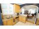 An open kitchen featuring granite counters, wooden cabinets, and stainless steel appliances at 5901 Chivalry Ct, Raleigh, NC 27612