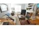Cozy living room with fireplace, built-in shelving, and comfortable seating area at 5901 Chivalry Ct, Raleigh, NC 27612