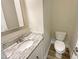 Bathroom featuring granite counters, a modern sink, and stylish wood-look floors at 6245 Reagan Ln, Wake Forest, NC 27587
