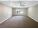Spacious bedroom featuring neutral walls, plush carpeting, and a bright window at 6245 Reagan Ln, Wake Forest, NC 27587
