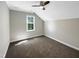 Bright bedroom with vaulted ceiling, plush carpeting, and a window with a view at 6245 Reagan Ln, Wake Forest, NC 27587