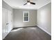 Cozy bedroom with a ceiling fan, window with blinds, and neutral-toned walls at 6245 Reagan Ln, Wake Forest, NC 27587