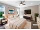 Bright bedroom with ceiling fan, modern decor, and plush rug, creating a relaxing space at 6245 Reagan Ln, Wake Forest, NC 27587