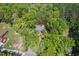Bird's eye view of the house nestled in a serene, wooded setting at 6614 Chantilley Place, Bahama, NC 27503