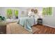 Cozy bedroom with a private outdoor deck, natural light, woven decor, and neutral color palette at 6614 Chantilley Place, Bahama, NC 27503