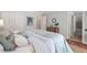 Serene bedroom with neutral tones, ensuite bathroom access, decor art, and warm natural lighting at 6614 Chantilley Place, Bahama, NC 27503