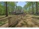 Inviting home featuring a fenced-in yard and a relaxing, natural wooded backdrop at 6614 Chantilley Place, Bahama, NC 27503