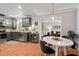 Stylish kitchen with stainless appliances open to dining and living areas at 6614 Chantilley Place, Bahama, NC 27503