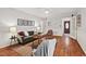 Cozy living room with hardwood floors, comfortable seating, and natural light at 6614 Chantilley Place, Bahama, NC 27503