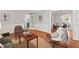 Open living area showcasing hardwood floors and seamless flow to dining space at 6614 Chantilley Place, Bahama, NC 27503