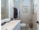 Neutral toned bathroom with a white single vanity and decor at 7308 York, Mebane, NC 27302