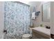 Bathroom with vanity and blue patterned shower curtain at 7308 York, Mebane, NC 27302