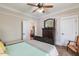 Bedroom showcasing a ceiling fan, carpet, and a dark wood dresser at 7308 York, Mebane, NC 27302