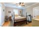 Bedroom features wood floors, ceiling fan, and natural light at 7308 York, Mebane, NC 27302