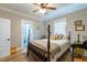 Bedroom featuring wood floors, ceiling fan, and natural light at 7308 York, Mebane, NC 27302