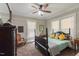 Cozy bedroom featuring a ceiling fan, carpet, and natural light from the windows at 7308 York, Mebane, NC 27302