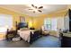 Bright bedroom featuring neutral decor, carpeted floors, and ample natural light at 7308 York, Mebane, NC 27302
