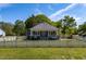 Charming home with a well-manicured lawn, white picket fence, and a welcoming front porch at 7308 York, Mebane, NC 27302