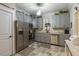 Updated kitchen featuring gray cabinets, stainless steel appliances and lots of counter space at 7308 York, Mebane, NC 27302