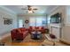 Charming living room featuring a fireplace, hardwood floors, and comfortable furnishings perfect for relaxation at 7308 York, Mebane, NC 27302