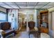 Sitting area showing chairs, bookcase, and view into the dining room at 7308 York, Mebane, NC 27302