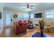 Cozy living room with hardwood floors, neutral walls, fireplace, and comfortable seating arrangement at 7308 York, Mebane, NC 27302