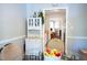 Bright dining area with a glass table, a decorative hutch, and a view into the living space at 861 Dalewood Dr, Raleigh, NC 27610