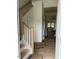 Bright foyer featuring hardwood floors, stairs with a wood handrail, and natural light at 1003 Shovelhead Dr # 2, Durham, NC 27703
